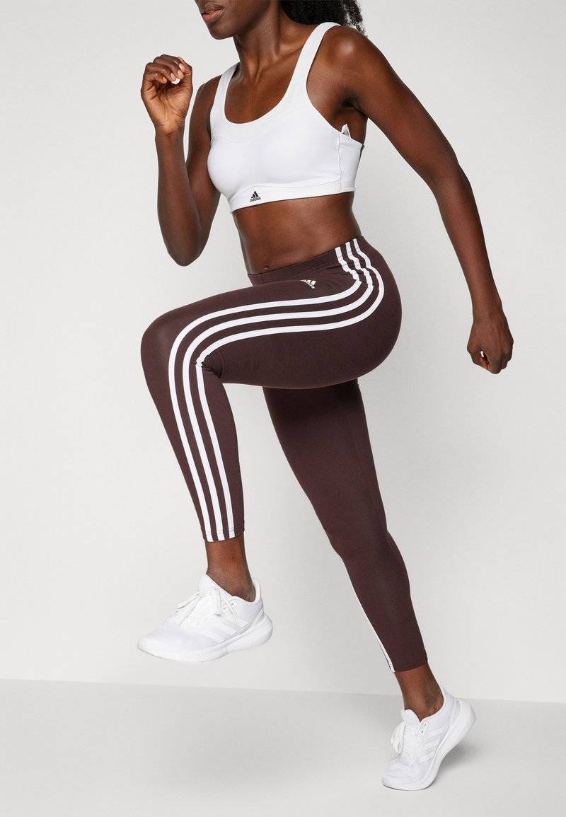 adidas Sportswear adidas Sportswear ESSENTIALS 3 STRIPES HIGH WAISTED - Leggings - shadow brown Tiefpreis