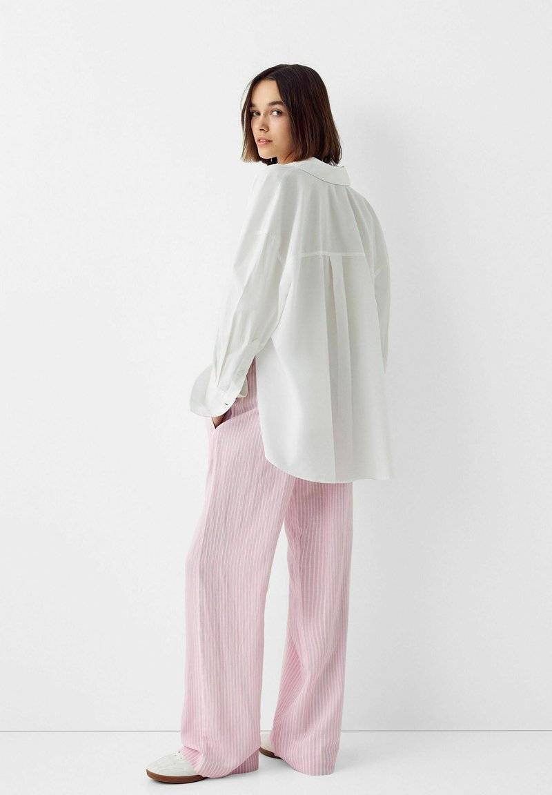 Bershka Bershka WITH AN ELASTIC - Trousers - light pink Günstiger Verkauf