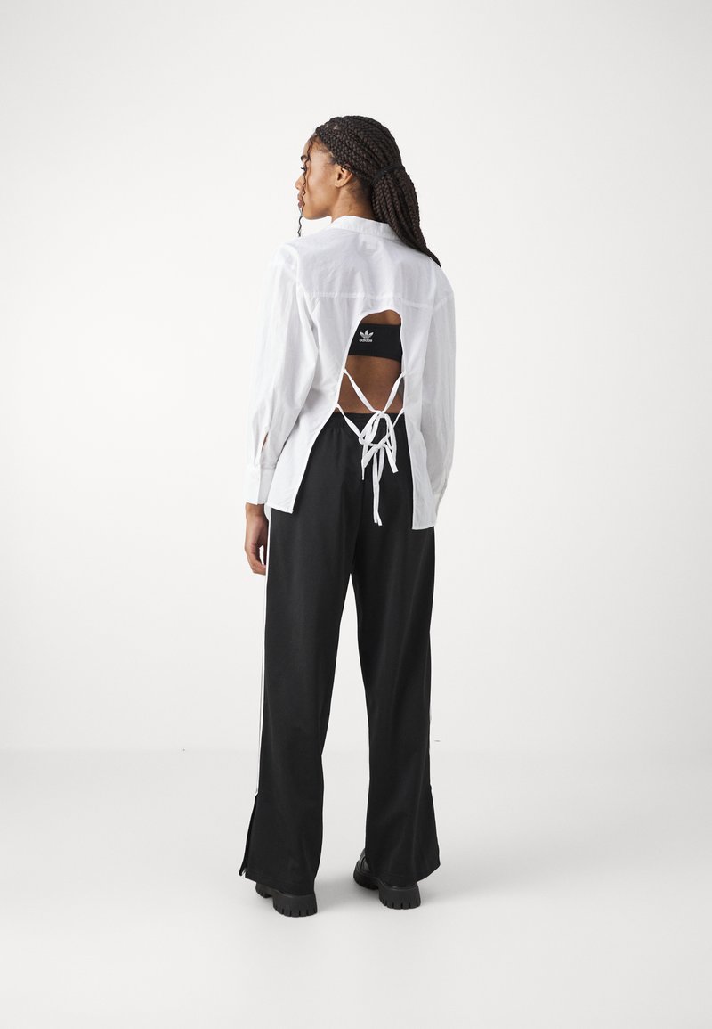 adidas Originals adidas Originals FBIRD LOOSE - Tracksuit bottoms - black 50% Rabatt für begrenzte Zeit