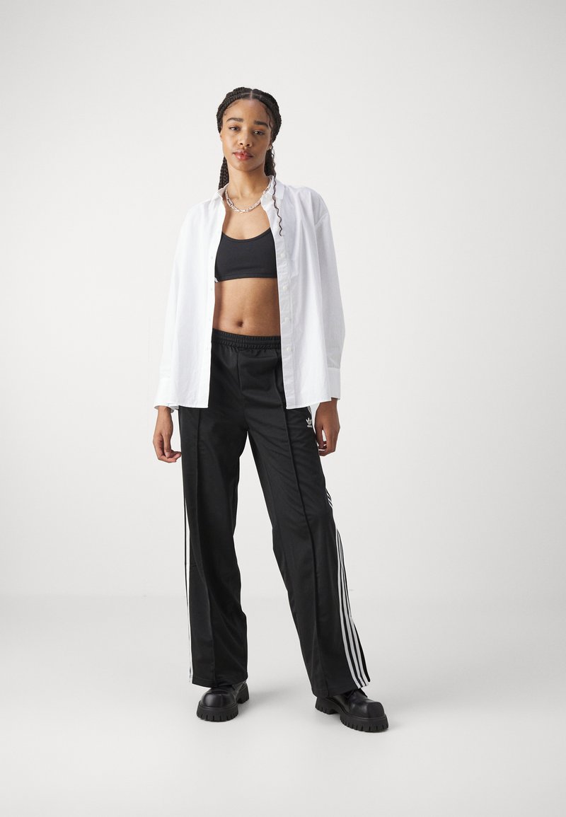 adidas Originals adidas Originals FBIRD LOOSE - Tracksuit bottoms - black 50% Rabatt für begrenzte Zeit