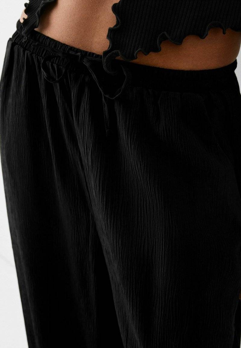 Bershka Bershka Trousers - black 2025