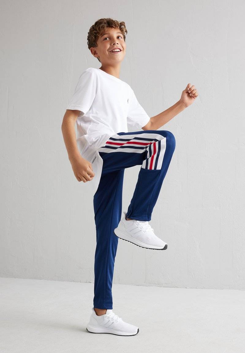 adidas Performance adidas Performance TIRO NATIONS PACK UNISEX - Tracksuit bottoms Rabatt