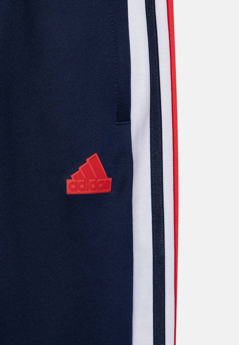 adidas Performance adidas Performance TIRO NATIONS PACK UNISEX - Tracksuit bottoms Rabatt