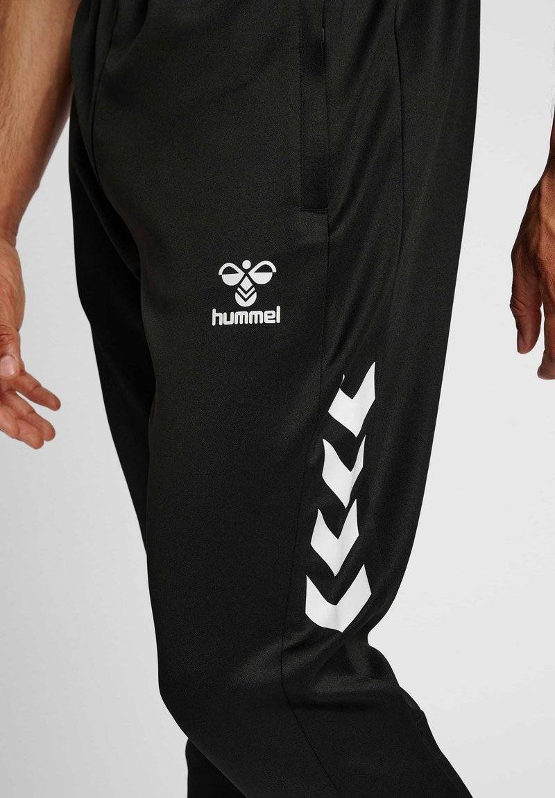 Hummel Hummel CORE XR TRAINING PANTS - Tracksuit bottoms - black Begrenztes Angebot