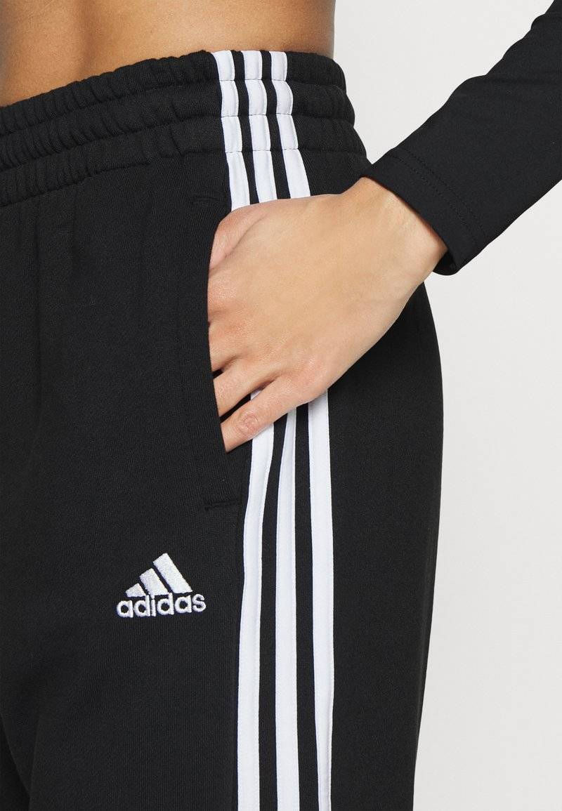 adidas Sportswear adidas Sportswear ESSENTIALS 3-STRIPES LOOSE-FIT - Tracksuit bottoms Jubiläumsangebot