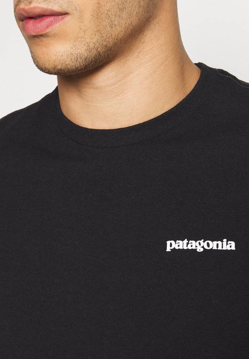 Patagonia Patagonia LOGO TEE - Print T-shirt - black Fabrikpreis