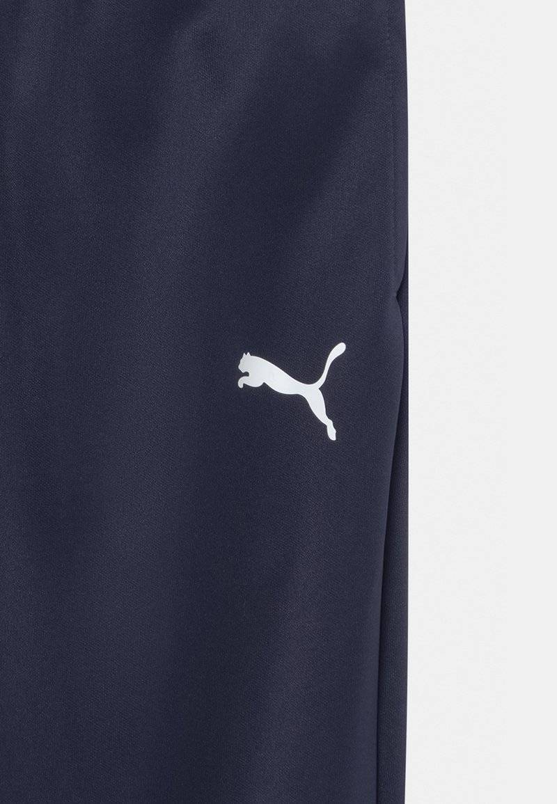 Puma Puma TEAMRISE POLY TRAINING UNISEX - Tracksuit bottoms Fabrikpreis