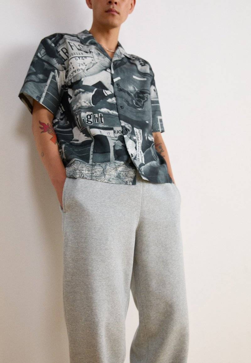Nike Sportswear Nike Sportswear BUNGIE PANT - Tracksuit bottoms - grey heather Begrenzte Freigabe