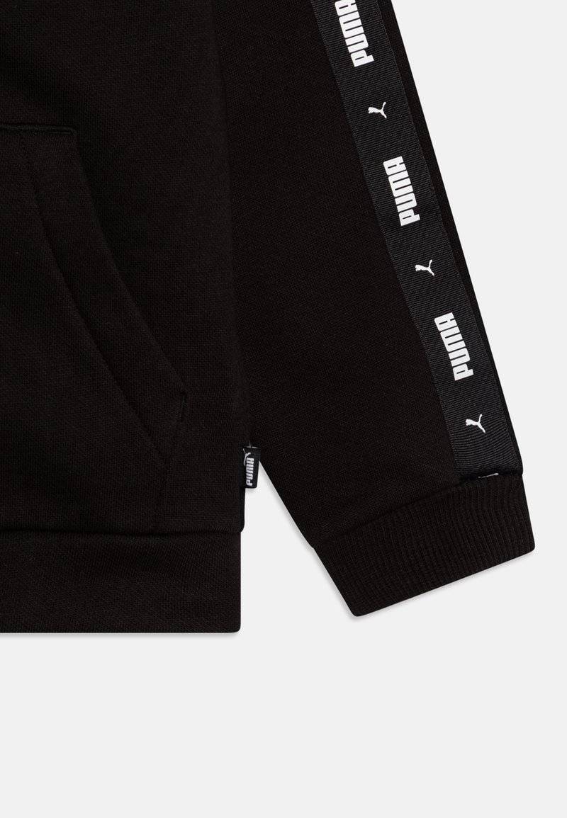 Puma Puma TAPE SWEAT SUIT UNISEX SET - Tracksuit - black Osterangebot