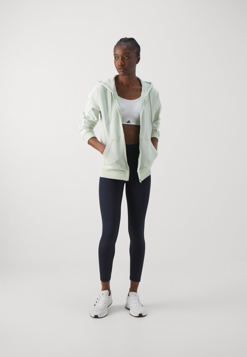adidas Sportswear adidas Sportswear ESSENTIALS 3 STRIPES FULL ZIP HOODIE - Zip-up sweatshirt - linen green Letzte 2 Tage