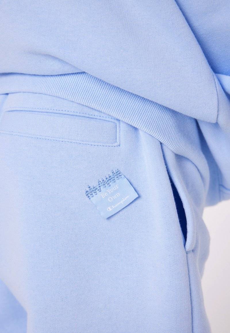 Champion Champion EXCLUSIVE PANT UNISEX - Tracksuit bottoms - light blue VIP-Rabatte