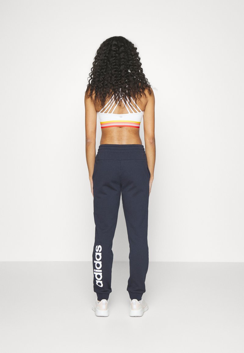 adidas Sportswear adidas Sportswear ESSENTIALS LINEAR CUFFED - Tracksuit bottoms - legend ink Nur noch ein Tag übrig