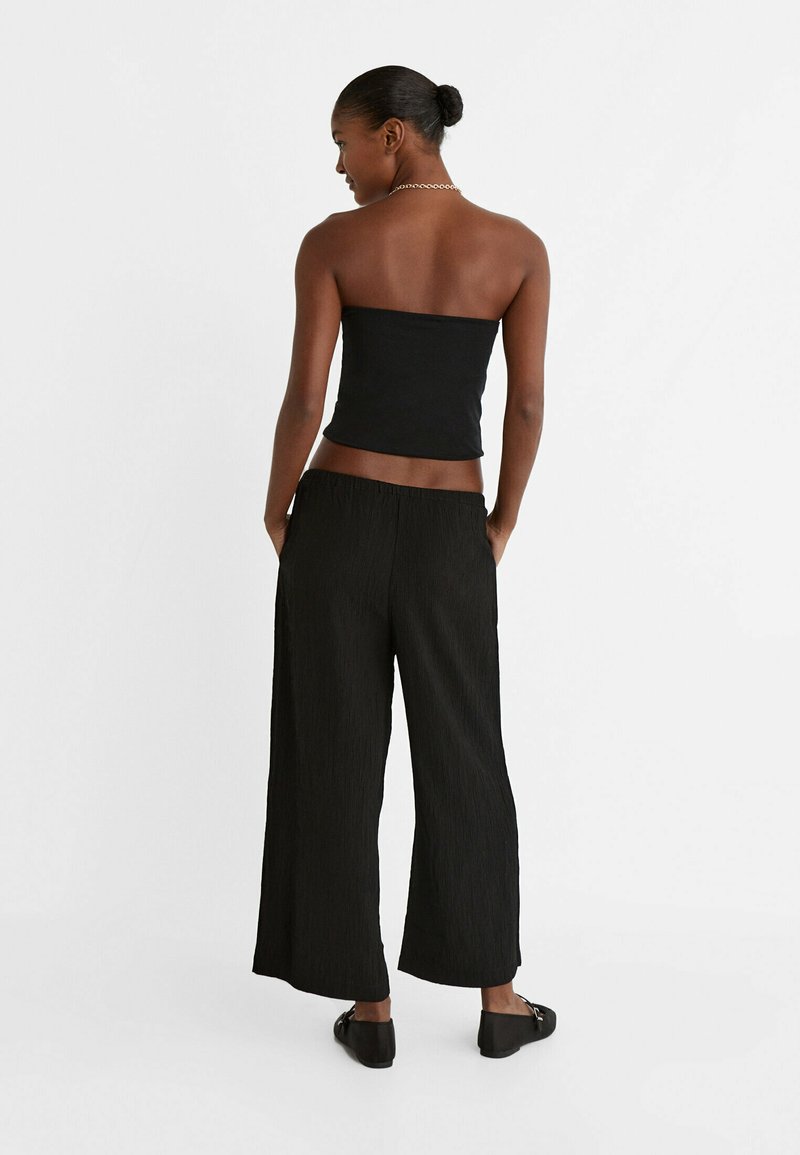 Stradivarius Stradivarius FLOWING CULOTTES - Trousers - black Fabrik Onlineshop