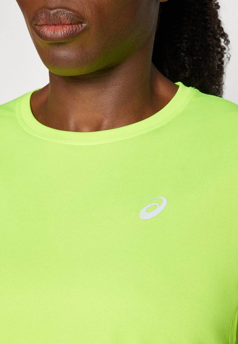 ASICS ASICS CORE TOP - Sports T-shirt - safety yellow Weihnachtsangebot