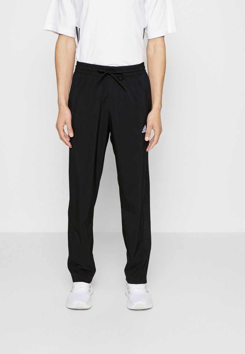 adidas Sportswear adidas Sportswear ESSENTIALS - Tracksuit bottoms - black