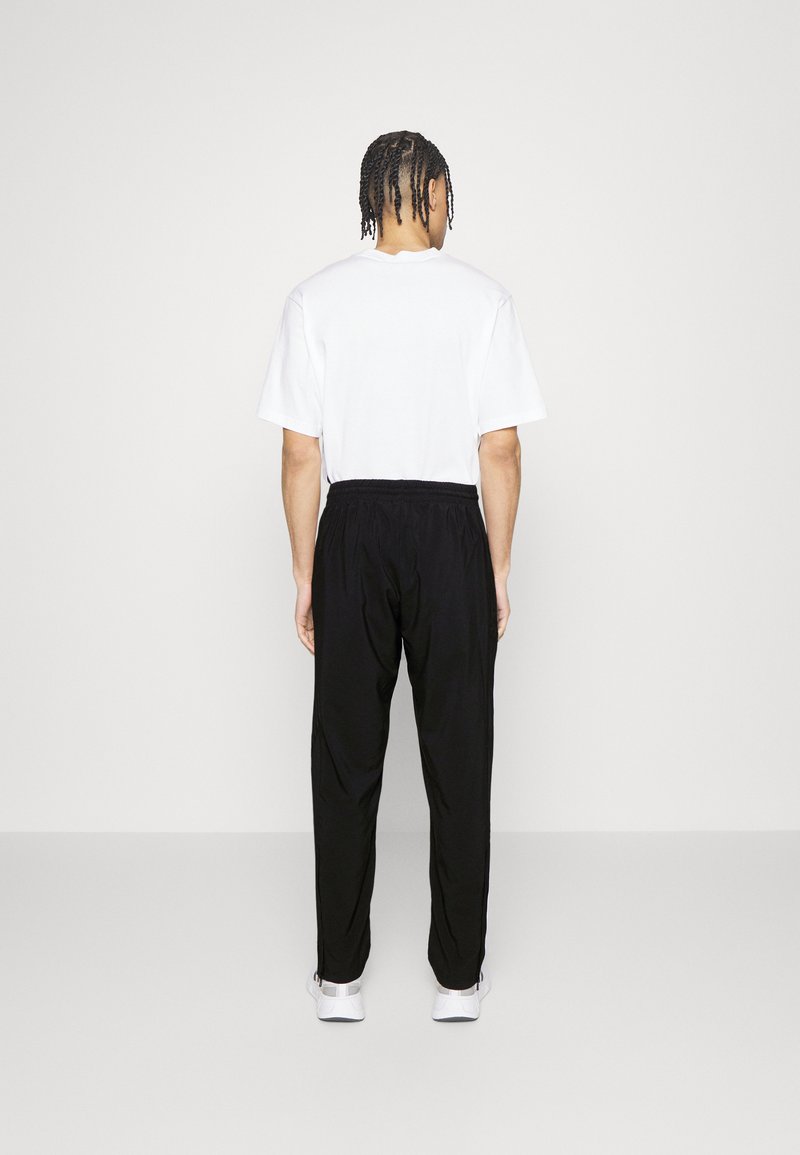 adidas Sportswear adidas Sportswear ESSENTIALS - Tracksuit bottoms - black Online Outlet