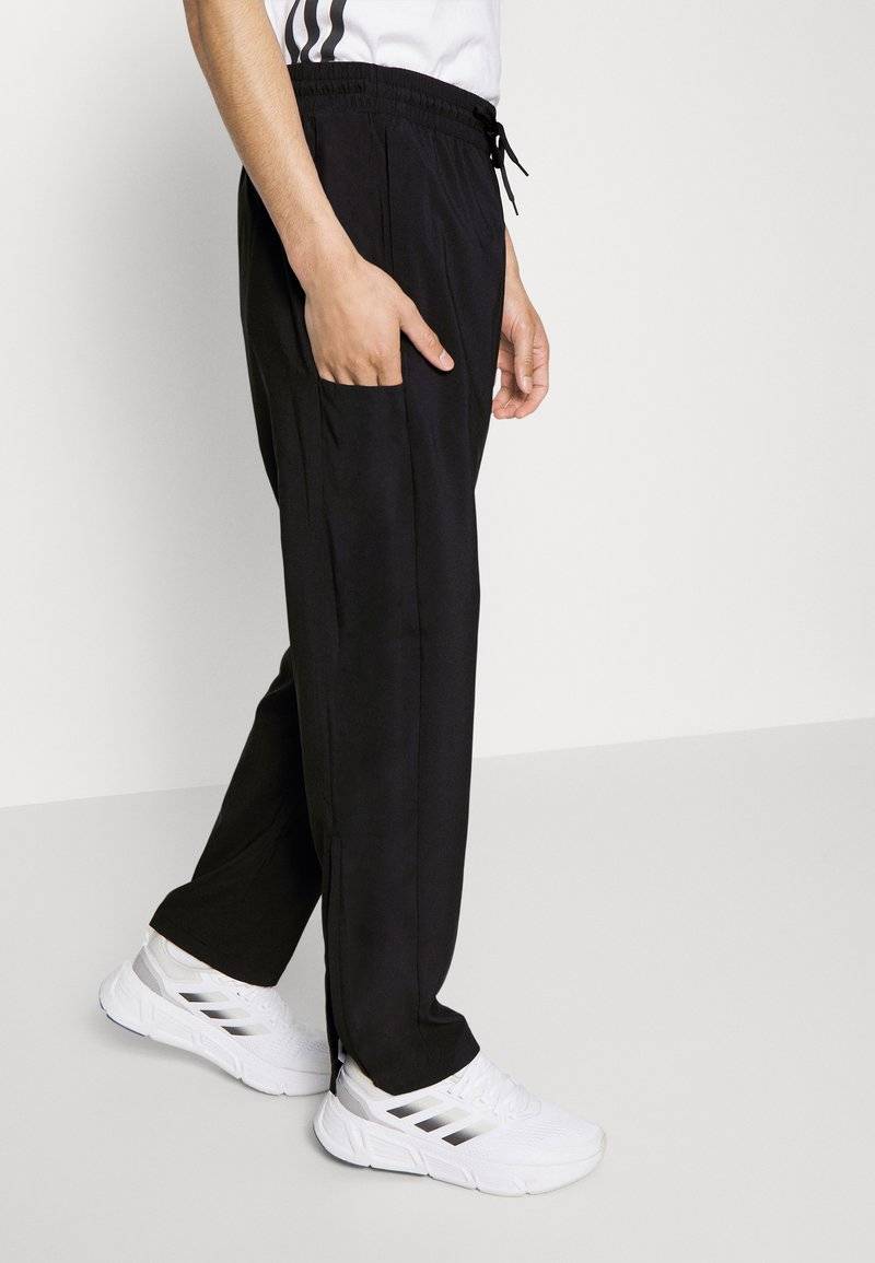 adidas Sportswear adidas Sportswear ESSENTIALS - Tracksuit bottoms - black Online Outlet