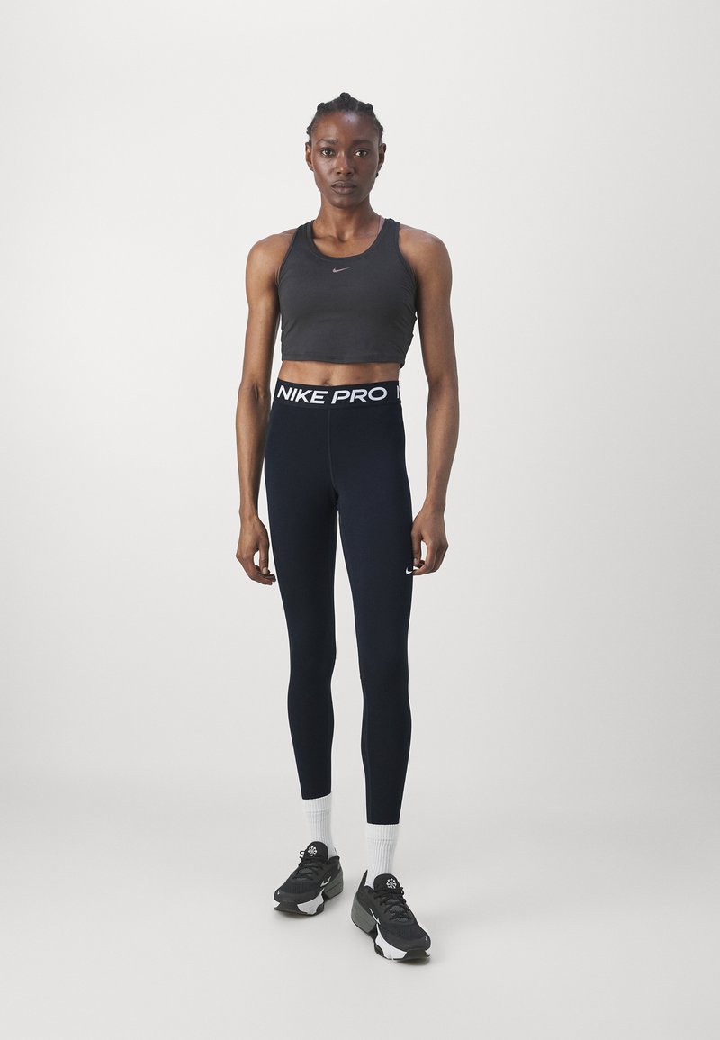 Nike Performance Nike Performance Leggings - black Bis zu 55% Rabatt