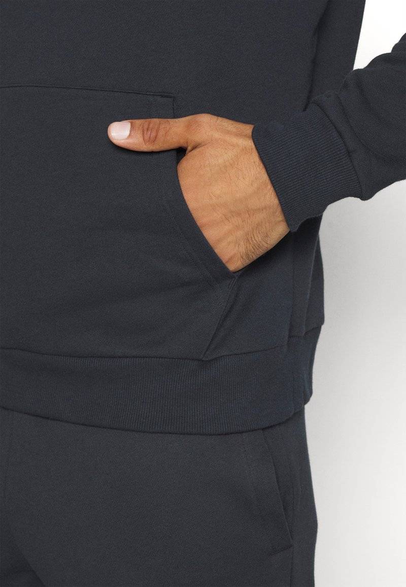Under Armour Under Armour RIVAL HOODIE - Hoodie - black Osterangebot
