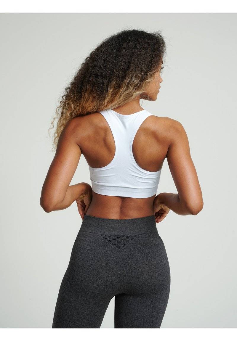 Hummel Hummel SEAMLESS - Medium support sports bra - white Bestseller